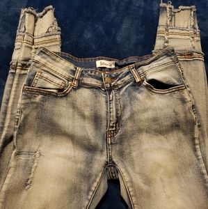 Dark wash distressed skinny jeans